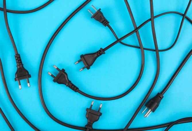 Loose power cords on blue background