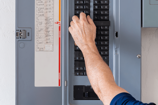 An electrician doing an electrical panel upgrade